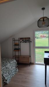Postel nebo postele na pokoji v ubytování Gîte Les Aravis + 20 fotografií