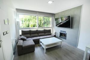 a living room with a couch and a coffee table at Etonnante Villa Carrio à Calpe by LG Home in Calpe