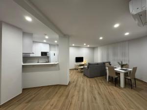 a living room with a couch and a table at Apartamentos La Paz in Ibi