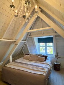Postel nebo postele na pokoji v ubytování Rhynhoven Lodge