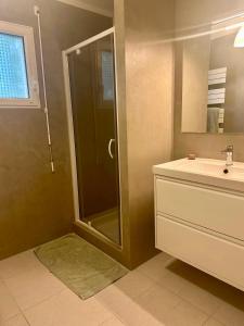 a bathroom with a shower and a sink at Maison de charme au calme in Fouesnant +38 photos