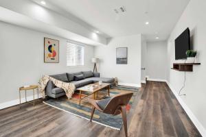 a living room with a couch and a table at La Rooftop Paradise 2 in Los Angeles