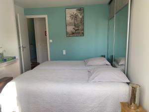 Postel nebo postele na pokoji v ubytování Le Moulin Bleu