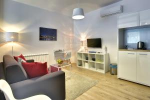 TV at/o entertainment center sa D&A Center Apartments with FREE Parking