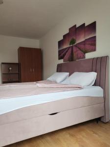 Postel nebo postele na pokoji v ubytování Apartman Franc