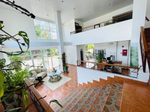 an open living room with a staircase and a living room at Hotel Coronado Inn in Playa Coronado