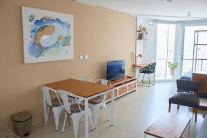 Posezení v ubytování Inmejorable! Piso alto en Centro BsAs, Moderno con parrilla y pileta 3 pax + 39 fotografií