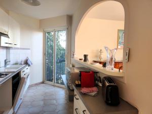 Η κουζίνα ή μικρή κουζίνα στο Appartement ORION magnifique vue mer et montagne