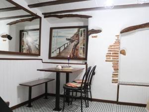 a dining room with a table and chairs in a room at Casa Nostra Alcanar in Alcanar +11 photos