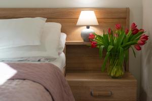 Voodi või voodid majutusasutuse Hotel Tulipan toas