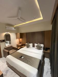 Postel nebo postele na pokoji v ubytování Hotel Pulse Town