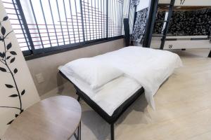 4F Guest House NETOMARI 西九条駅から徒歩2分にあるベッド