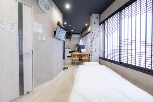 4F Guest House NETOMARI 西九条駅から徒歩2分にあるベッド