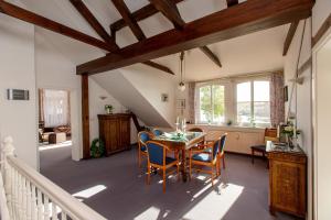 a dining room with a table and chairs at Villa Blanck in Malchow
