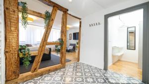 a room with a door leading to a bedroom at Luxx Home RV, City Marienplatz in Ravensburg +83 photos