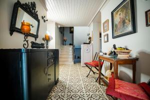 a kitchen with a black refrigerator and a table at Bozcaada Biz Otel in Bozcaada +70 photos