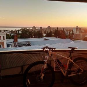 a bike parked on top of a building at Excelente departamento, a metros del Shopping Paso del Paraná, vista al río Paraná - silencio - ideal para descansar - barrio residencial - Cámaras de seguridad 24hs - unidad Monitoreada in Paraná