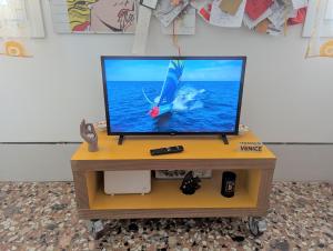 Televízia a/alebo spoločenská miestnosť v ubytovaní A CASA DI PEPLIS
