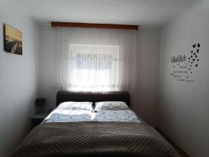 Ella Ferienwohnung客房内的一张或多张床位
