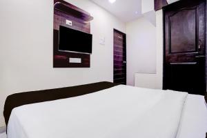 Postel nebo postele na pokoji v ubytování Hotel O Class Inn