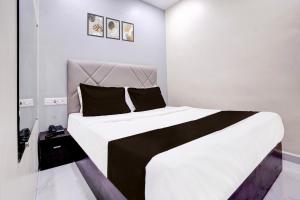 Postel nebo postele na pokoji v ubytování Hotel O Class Inn + 21 fotografií