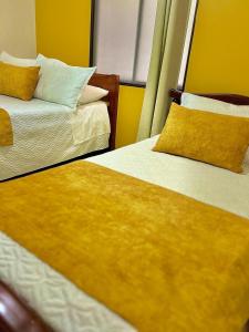 Postel nebo postele na pokoji v ubytování Hotel Dorado Jardín