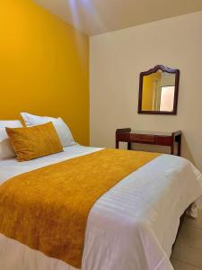 Postel nebo postele na pokoji v ubytování Hotel Dorado Jardín