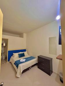 Postel nebo postele na pokoji v ubytování Hotel Dorado Jardín