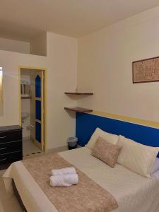 Postel nebo postele na pokoji v ubytování Hotel Dorado Jardín