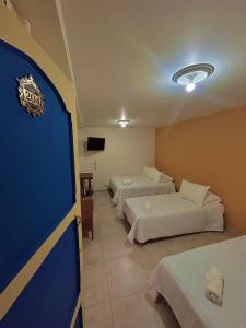 Postel nebo postele na pokoji v ubytování Hotel Dorado Jardín