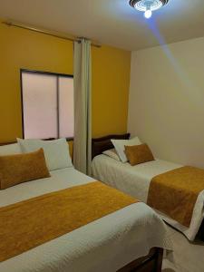 Postel nebo postele na pokoji v ubytování Hotel Dorado Jardín