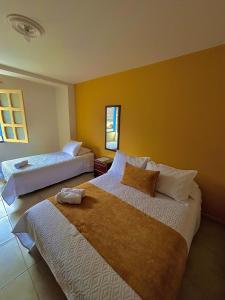 Postel nebo postele na pokoji v ubytování Hotel Dorado Jardín