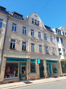 a large brick building on the corner of a street at Fewo Mittags-Ruh in Reichenbach im Vogtland
