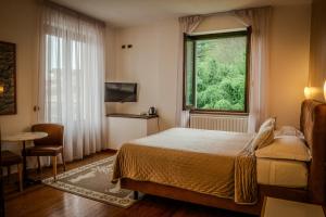Postel nebo postele na pokoji v ubytování Hotel Sonenga + 37 fotografií