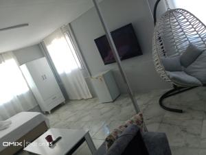 a living room with a couch and a chair at Duygu Otel Konaklama in Karatas +37 photos
