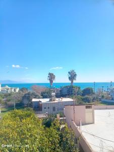 a view of the beach and ocean from a building at Duygu Otel Konaklama in Karatas