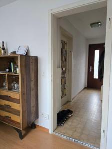 a hallway with a door open to a room at Steinlisonne in Möhlin