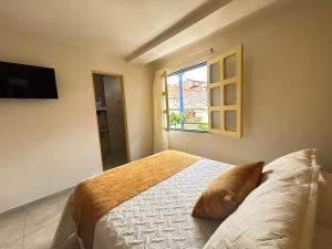 Postel nebo postele na pokoji v ubytování Hotel Dorado Jardín