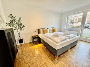 Katil atau katil-katil dalam bilik di MEL&BENS Modern Oak-Apartments für bis zu 12 Personen