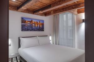 Postel nebo postele na pokoji v ubytování Anastasia Suites