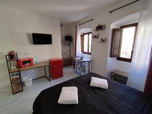 TV a/nebo společenská místnost v ubytování B&B gli Ombrellini