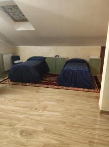Postel nebo postele na pokoji v ubytování Spazioso appartamento su due piani