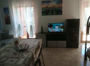 TV a/nebo společenská místnost v ubytování Villa Elena