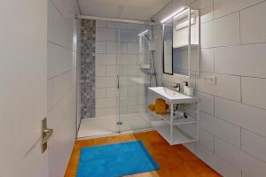 a bathroom with a shower and a sink and a mirror at Résidences Sopramare in Algajola +222 photos