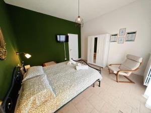 Postel nebo postele na pokoji v ubytování b&b il Melograno