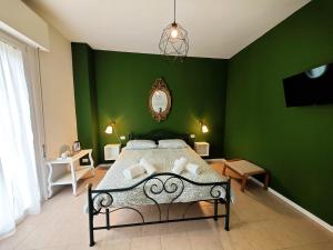 Postel nebo postele na pokoji v ubytování b&b il Melograno