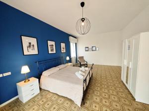Postel nebo postele na pokoji v ubytování b&b il Melograno