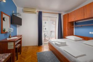 Posteľ alebo postele v izbe v ubytovaní Guest House Damir