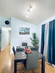 a dining room with a table and chairs at Modern Upper Level Duplex House in Slave Lake