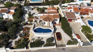 an aerial view of a house with a swimming pool at Villa Benitachell, La Cumbre del Sol in Benitachell
